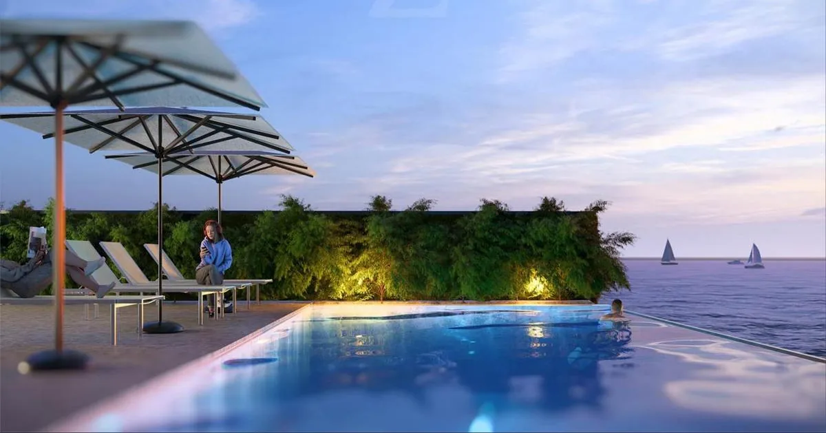 Infinity pool facing the sea with sun loungers and greenery, in a Z VIEW concept image